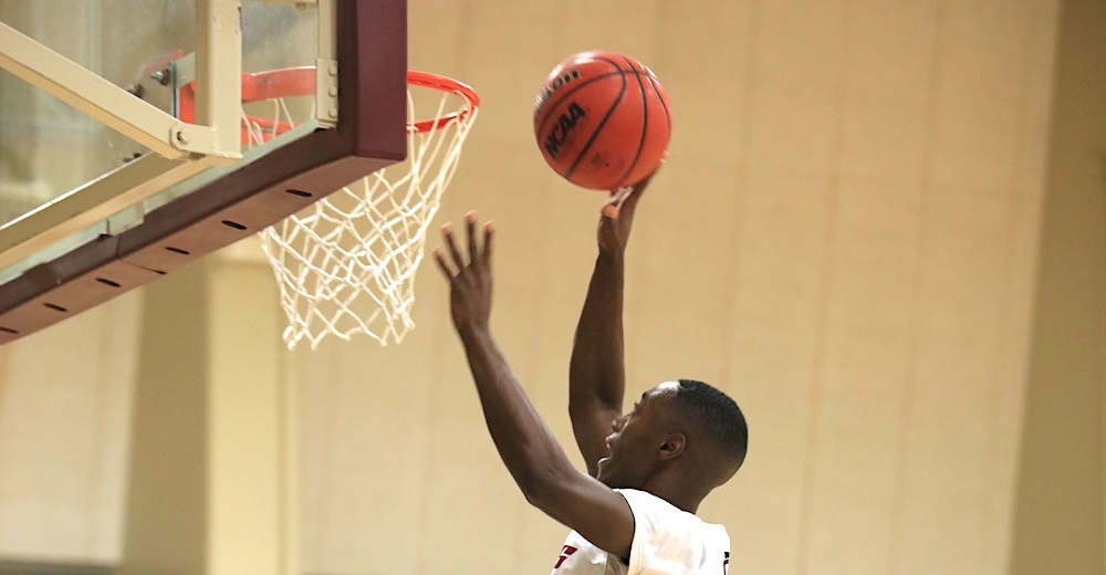 MPC Men's Basketball Player Going for a Basket