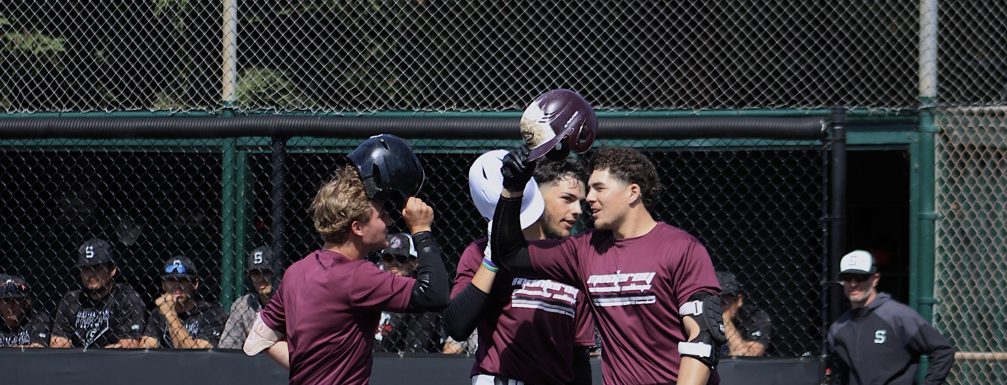 Three of MPC Men's Baseball Players Cheering Together