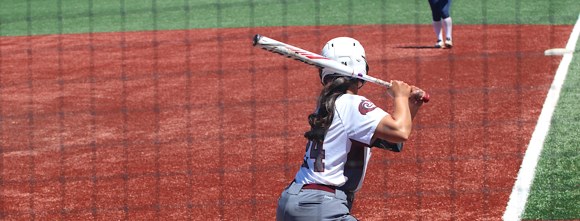 MPC Women's Softball Player Up to Bat During Game